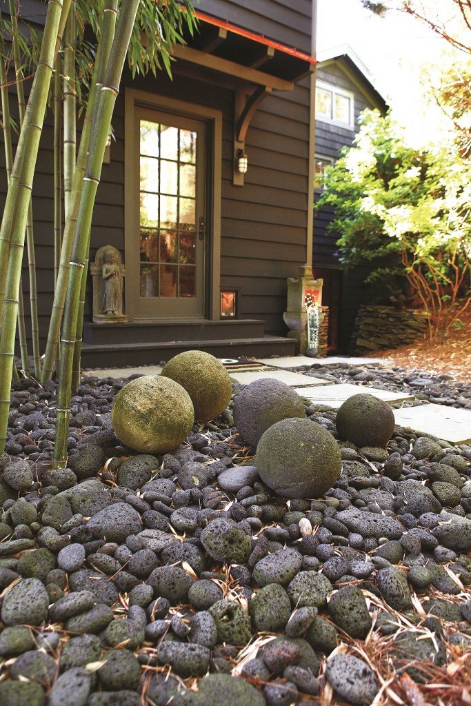 front yard with pebbles and plantings